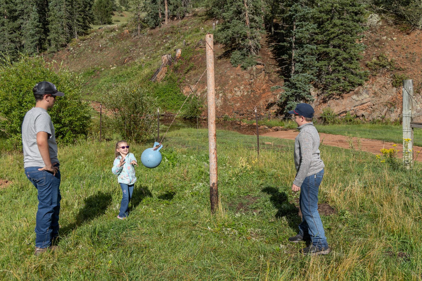 A family game of catch in the meadow